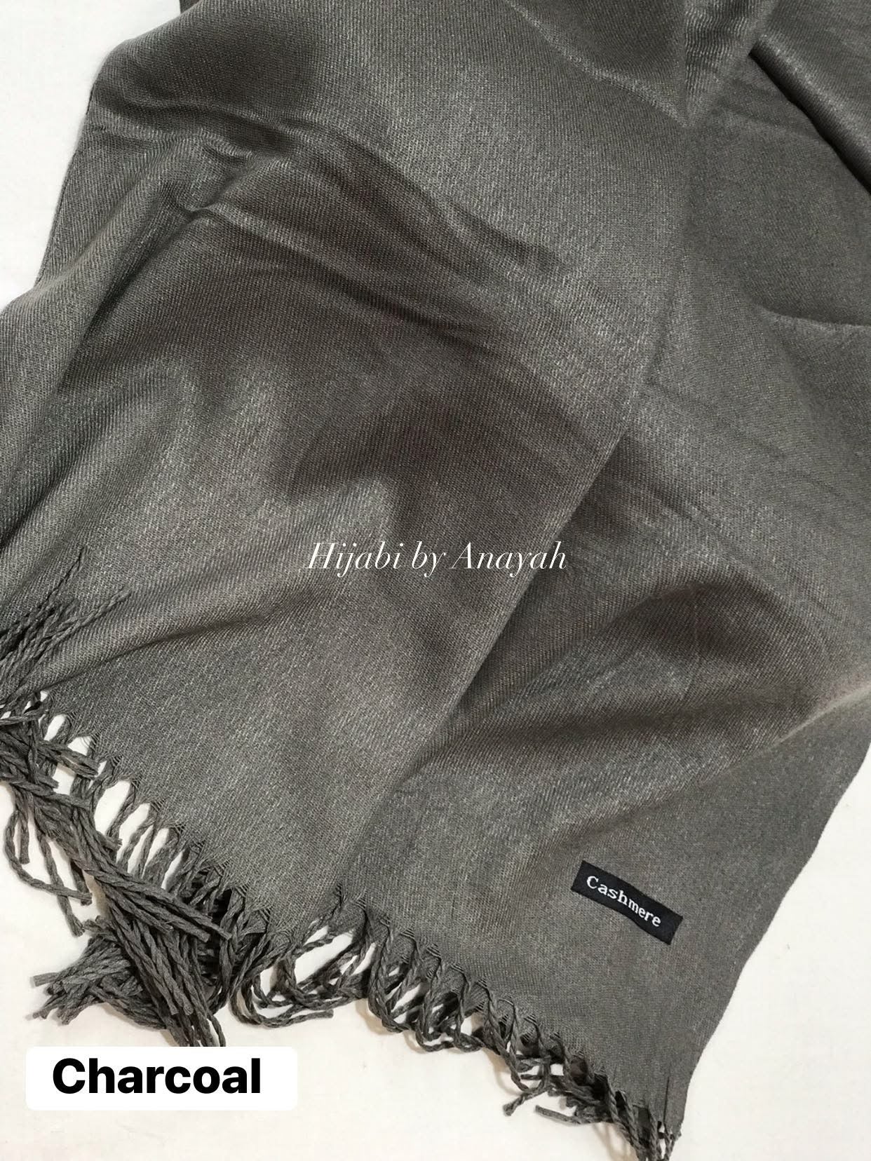 Gray hijab with brand label on a white background