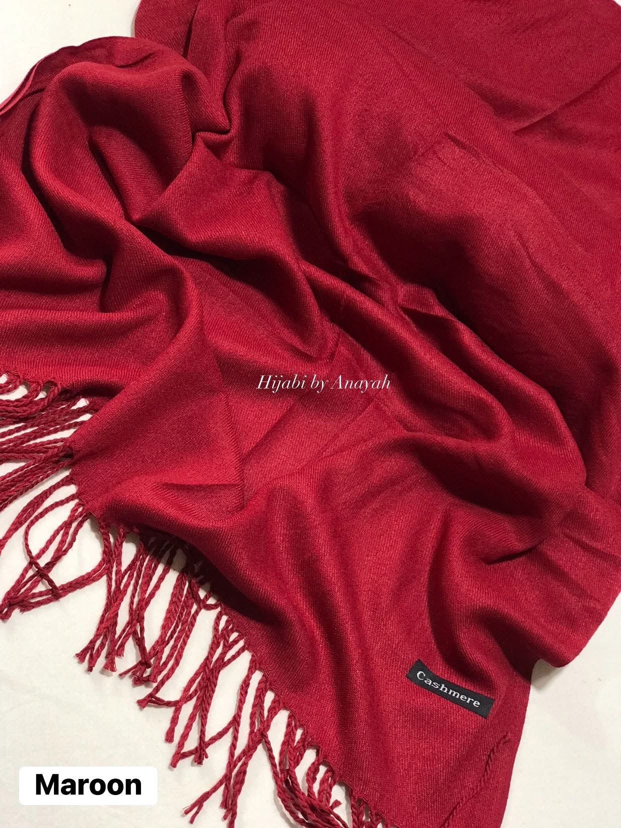 Maroon hijab with fringes and 'Cashmere' label on a white background